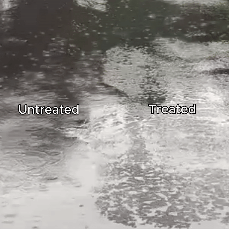 driveway-gif Side-by-side view of an asphalt driveway with one section treated using nano-scale protection and the adjacent section left untreated. On the untreated side, water spreads and ponds on the surface. On the treated side, hydrophobic surface chemistry causes water to bead and shed more readily, reducing surface wetting and limiting standing water. This behavior helps decrease moisture contact time with the asphalt following rainfall.